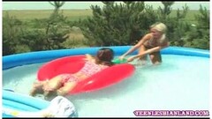 Lovely girls frolicking in the pool Thumb