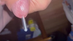 Using  sounding rod while masturbating Thumb