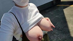 A frustrated married woman masturbates with her legs open and her breasts exposed in an outdoor park Thumb