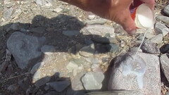 POURING A SHOTGLASS FULL OF CUM OVER THE ROCKS Thumb
