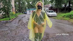 Teen in yellow raincoat flashes pussy outdoors in the rain Thumb